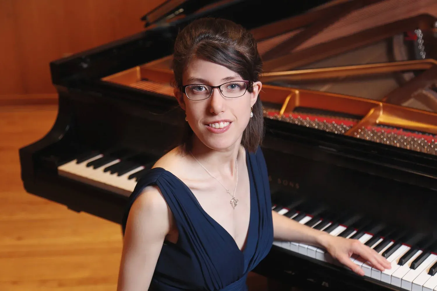 Dr. Carson Rose Schneider at the piano